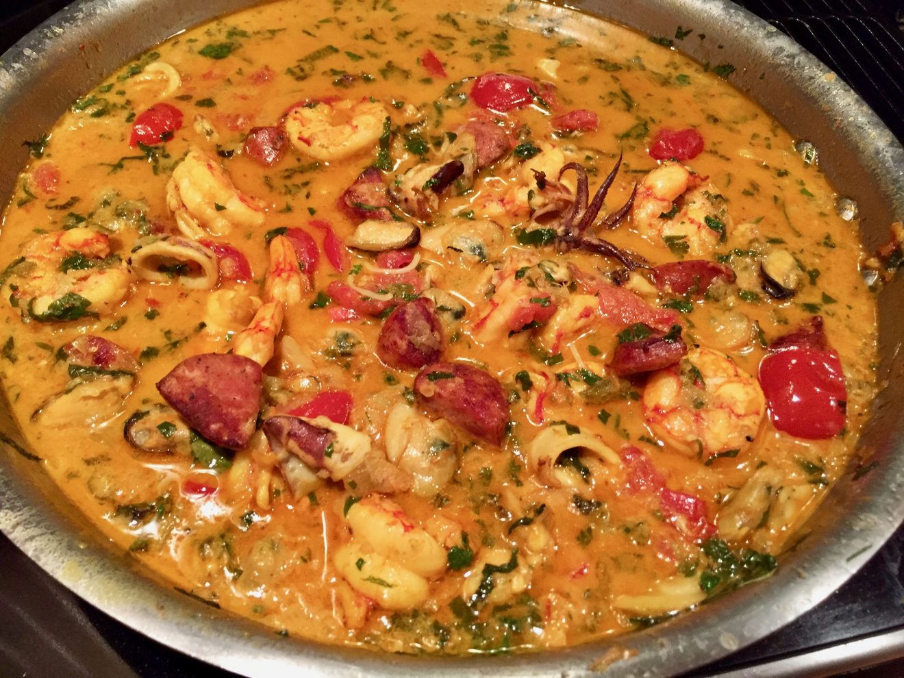 Seafood in Saffron Broth with Coconut Cream, Sausage and Vermicelli